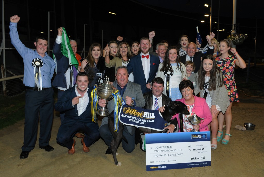 Joyous scenes on the track for Jaytee Jet’s connections after winning the William Hill Derby. At front L-R: Kevin Hennessy, owner John Turner, Paul and Susan Hennessy. Wimbledon 4th June 2016. Photo: Steve Nash