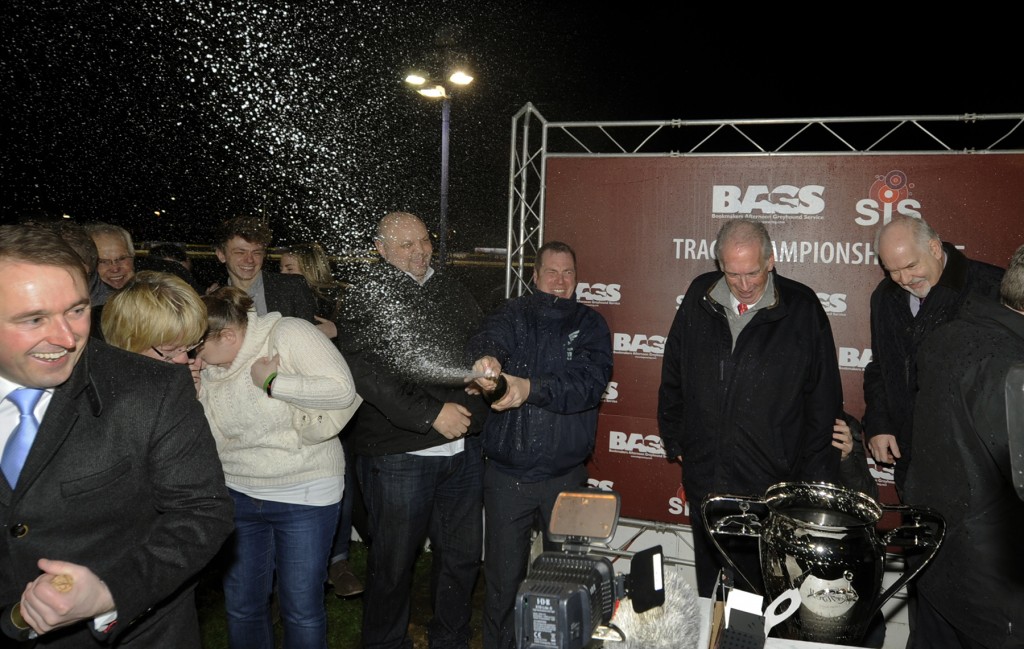 Champagne moment for Towcester in the Bags Track Championship. Mark Wallis risks the sack by soaking Lord Hesketh amongst others on the podium. Perry Barr 23rd December 2015. Photo: Steve Nash